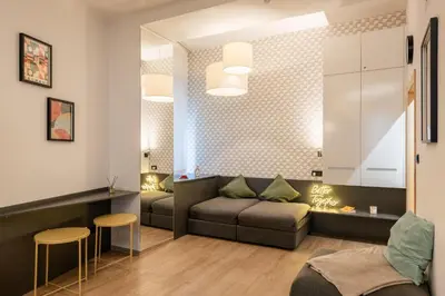 a living room with a couch and a table at Lighthouse Apartment in Prague