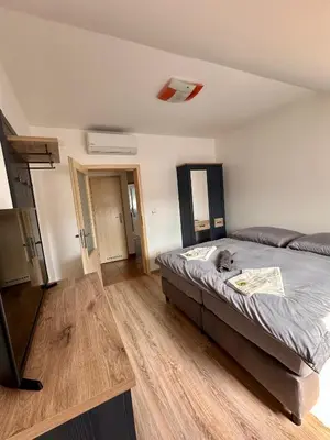 a bedroom with a bed in a room at Penzion Piller in Chvalín