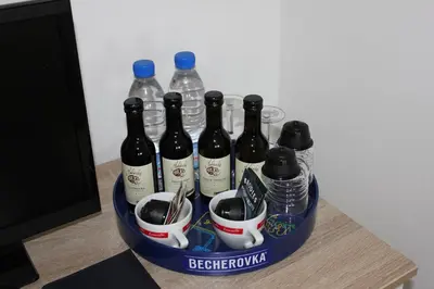a basket of bottles of wine on a table at Penzion Piller in Chvalín