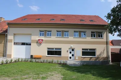 a large house with a red roof at Penzion Piller in Chvalín