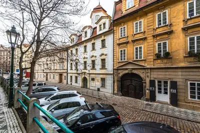 a row of cars parked in front of buildings at Apartment Municipal house Prague 1 Old town in Prague