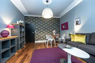 a living room with a couch and a table at Apartment Municipal house Prague 1 Old town in Prague