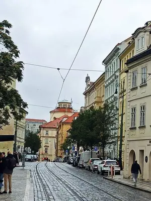 a city street with people walking down the street at Unique apartment near Charles Bridge in Prague