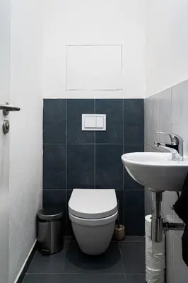 a bathroom with a toilet and a sink at Penthouse Tiger Deluxe in Prague