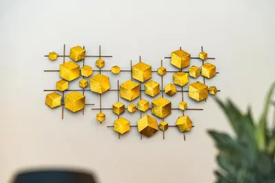 a bunch of yellow umbrellas hanging on a wall at Black Diamond Suite in Prague