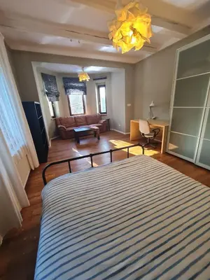 a living room with a couch and a coffee table at Guest Rooms in Private Home by Airport, Shared Bath, Non-Smoking, Contactless Check-in, No Staff, Quiet Stay, Short Stay in Kněžívka
