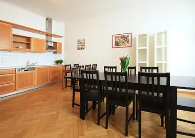 a kitchen with a dining room table and chairs at Quadrio Bedroom Central Apartment in Prague