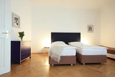 a bedroom with two beds and a dresser at Quadrio Bedroom Central Apartment in Prague