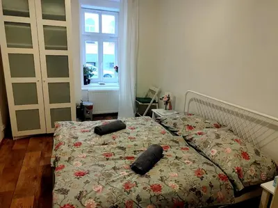 a bedroom with a bed with two pillows on it at Nice one bedroom apartment in zizkov in Prague