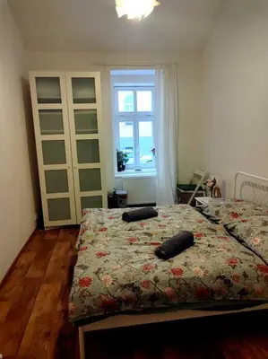 a bedroom with a bed with two pillows on it at Nice one bedroom apartment in zizkov in Prague