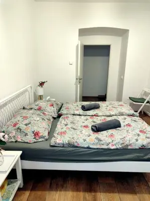 a bed with two pillows on it in a bedroom at Nice one bedroom apartment in zizkov in Prague