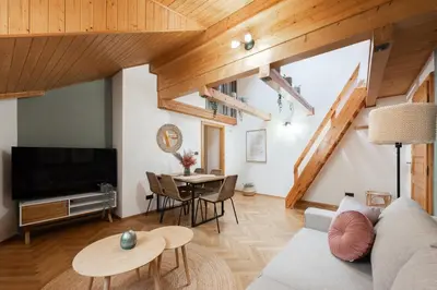 a living room with a couch and a table at Delux Romantic Stay Prague in Prague