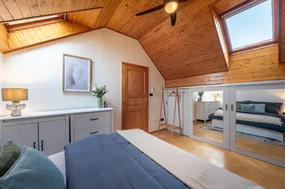 a room with a bed and a bedroom with a ceiling at Delux Romantic Stay Prague in Prague