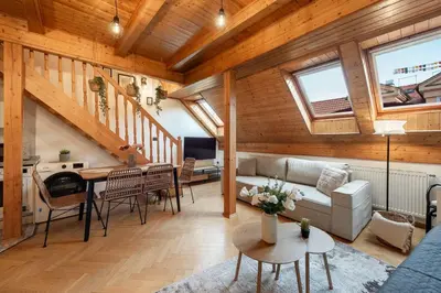 a living room with a couch and a table at Delux Romantic Stay Prague in Prague