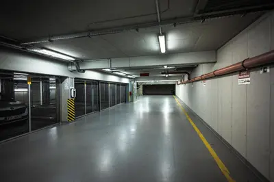 an empty parking garage with a long hallway at Luxury Angel Apartment with terrace in Prague