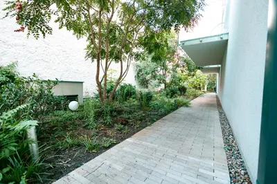 a brick walkway next to a building with trees at Luxury Angel Apartment with terrace in Prague