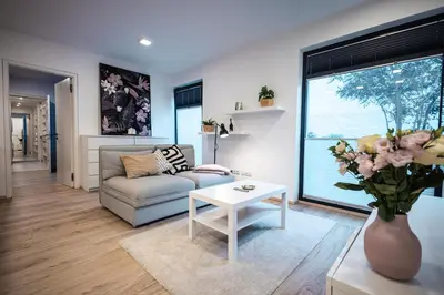 a living room with a couch and a table at Luxury Angel Apartment with terrace in Prague