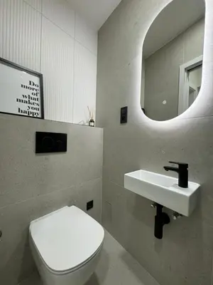 a bathroom with a toilet and a sink and a mirror at Rentero apartment, 4 minutes National Theather, Prague in Prague