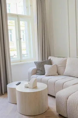 a living room with a couch and a coffee table at Rentero apartment, 4 minutes National Theather, Prague in Prague