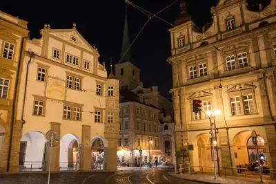 a city street at night with buildings and a street light at Adam's Apartment - Great Price & Best Location in Prague