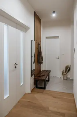 a hallway with a bench and a door at Prague Days - Two-bedroom Apartment with Workspace and Netflix in Nusle in Prague