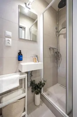 a bathroom with a sink and a shower at Prague Days - Cozy Studio with Netflix in Karlín in Prague