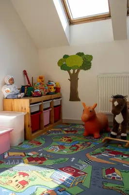 a childs room with toys on the floor at Holiday Home Prague Pruhonice in Pruhonice