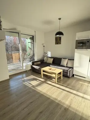 a living room with a couch and a table at Terrace Apartman Víšek in Prague