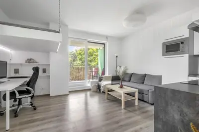 a living room with a couch and a table at Terrace Apartman Víšek in Prague