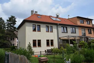 a large white house with a red roof at Classical House in Prague 6 in Prague