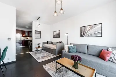 a living room with a couch and a table at All-in Family Apartment Prague in Prague