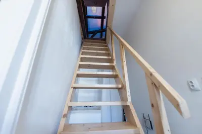 a ladder leading up to the top of a room at King's Royal Apartments in City Centre in Prague