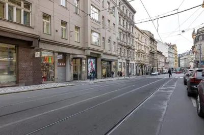 an empty street in a city with buildings at Chic & Central New Town Apartment by Subway in Prague