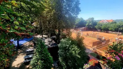 an overhead view of a park with trees and a field at Tenis Cibulka Suites in Prague