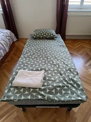 a bed sitting in a room with a mattress at Apartment in the Center of OId Town in Prague