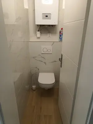 a small bathroom with a toilet and a sink at Apartment in the Center of OId Town in Prague