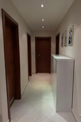 a hallway with a door and a tile floor at Apartmán Palma - 15 min od centra Prahy in Prague