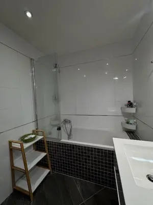 a bathroom with a shower and a toilet and a sink at Apartmán Palma - 15 min od centra Prahy in Prague