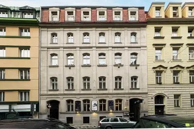 a large building with cars parked in front of it at The Wenceslas Loft in Prague