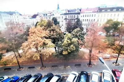 a bunch of parked cars in a parking lot at Arbes apartman in Prague