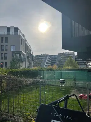 a view of a field in a city with buildings at Serene & Private Garden Oasis in Prague