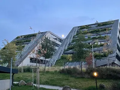 an apartment building with a staircase in front of it at Serene & Private Garden Oasis in Prague
