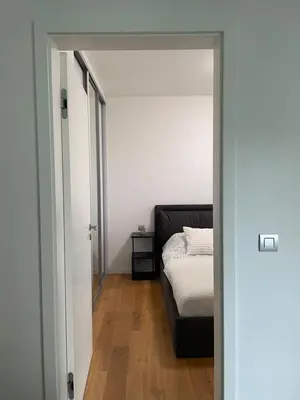 a bedroom with a bed and a couch in a room at Serene & Private Garden Oasis in Prague
