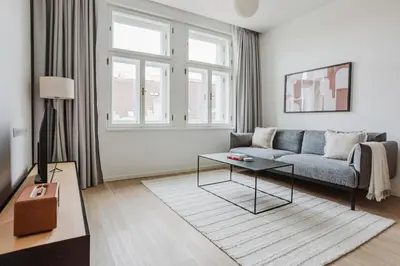 a living room with a couch and a table at Blueground Prague 2 renovated Náměstí Míru PRG-33 in Prague