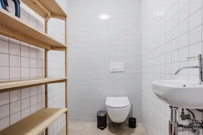 a bathroom with a toilet and a sink at Blueground Prague 2 renovated Náměstí Míru PRG-33 in Prague