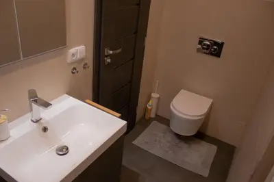 a bathroom with a white sink and a toilet at Apartmán u lesa Nové Jirny in Nové Jirny