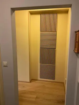a room with a door and a room with wooden floors at Apartmán u lesa Nové Jirny in Nové Jirny