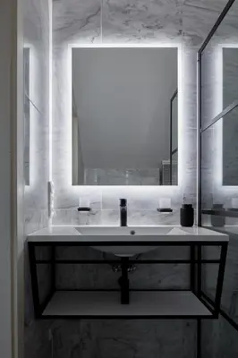 a bathroom with a sink and a mirror at Prague Days - Deluxe Loft with View in Vinohrady in Prague