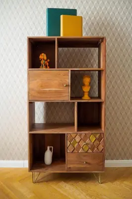 a wooden book shelf with various items on it at Rašínovo nábřeží - Riverside Residence in Prague