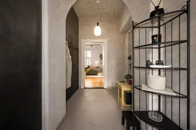 a hallway of a home with a room with at Prague Days - One-bedroom Apartment with Balcony and Workspace in Vinohrady in Prague